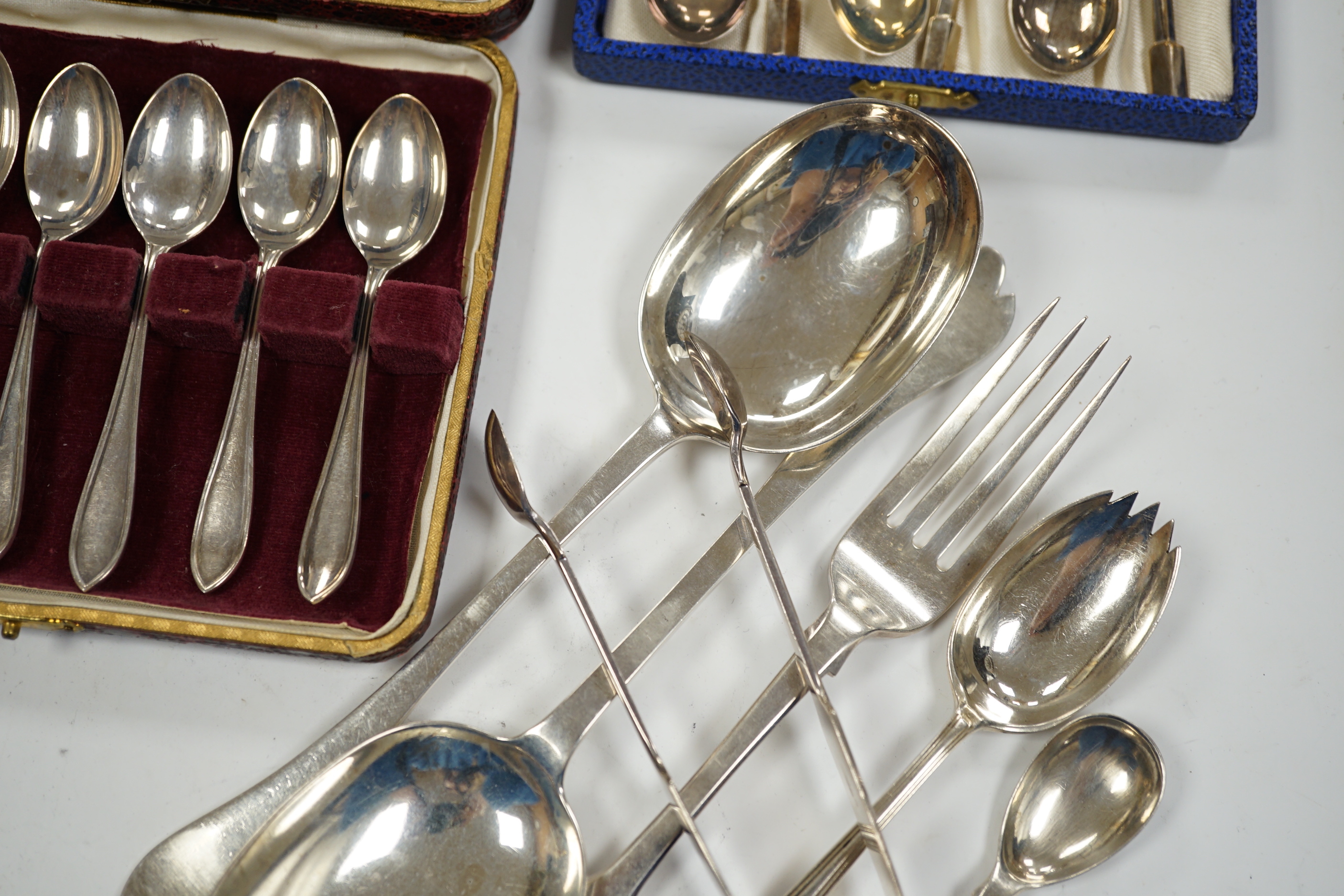 A pair of George V silver rat tail trefid spoons, Goldsmiths & Silversmiths Co Ltd, London, 1911, 20.2cm, three cased sets of silver coffee spoons and other silver flatware